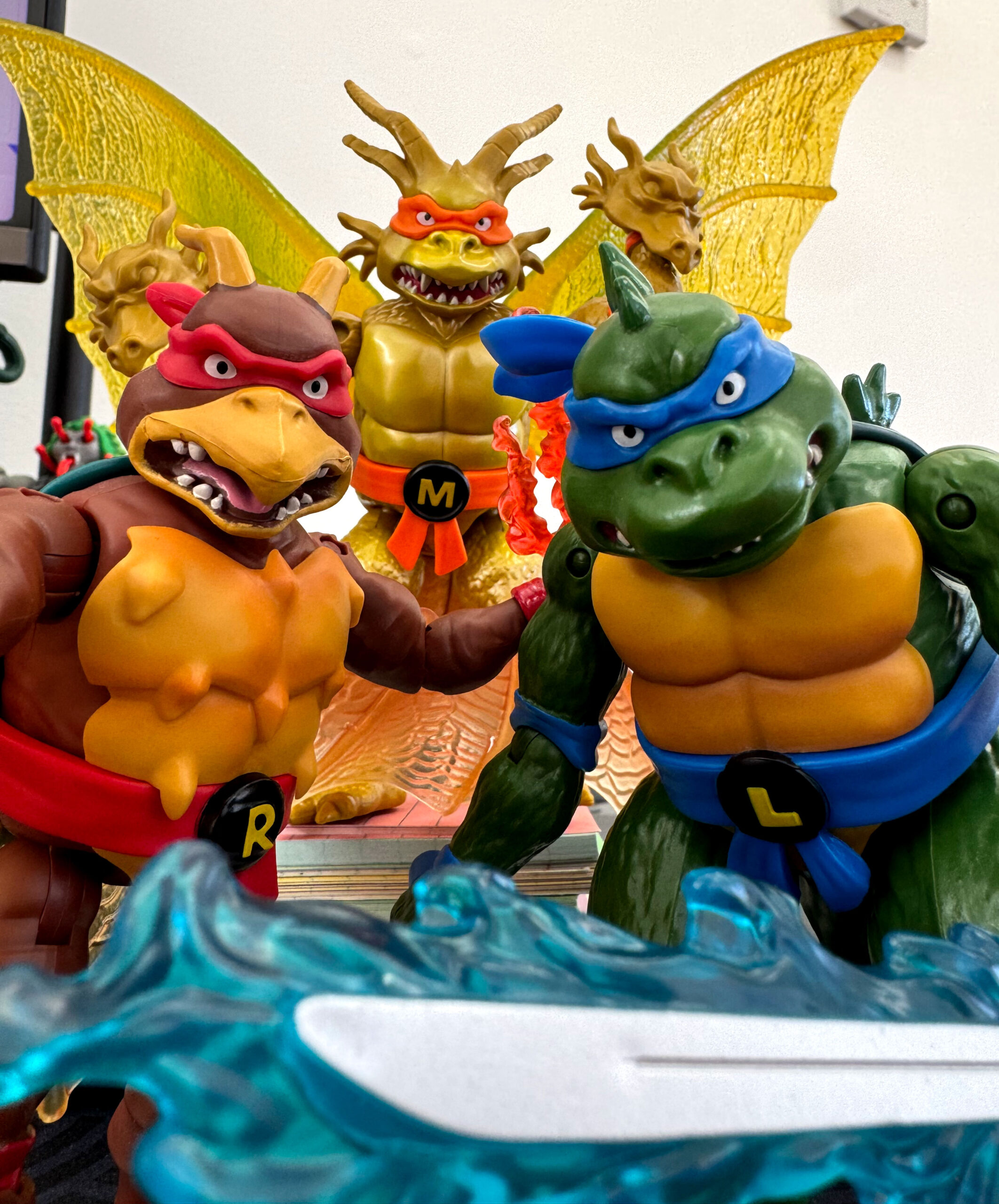The three figures from wave 1 of TMNT x Godzilla